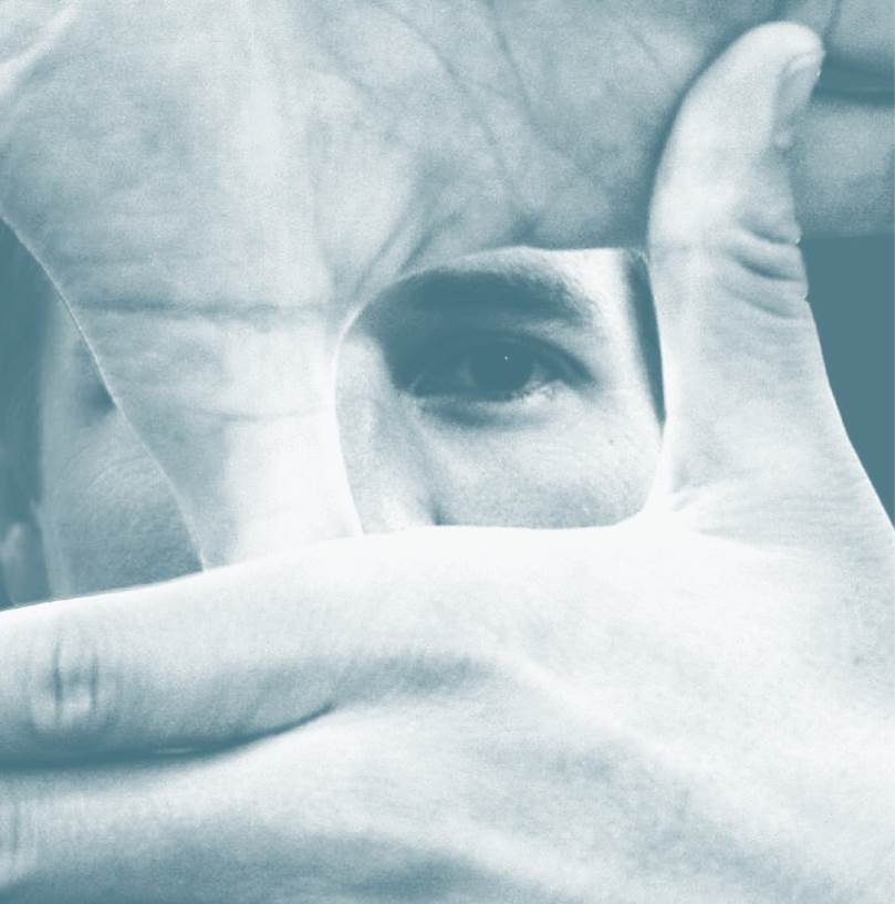 man focusing with hands